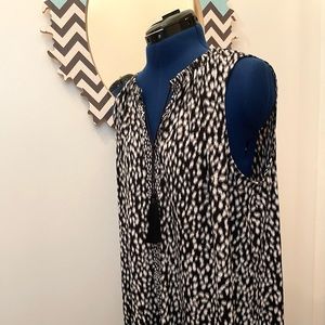 Sleeveless midi with tassel tie at neckline. Size XL or 14
